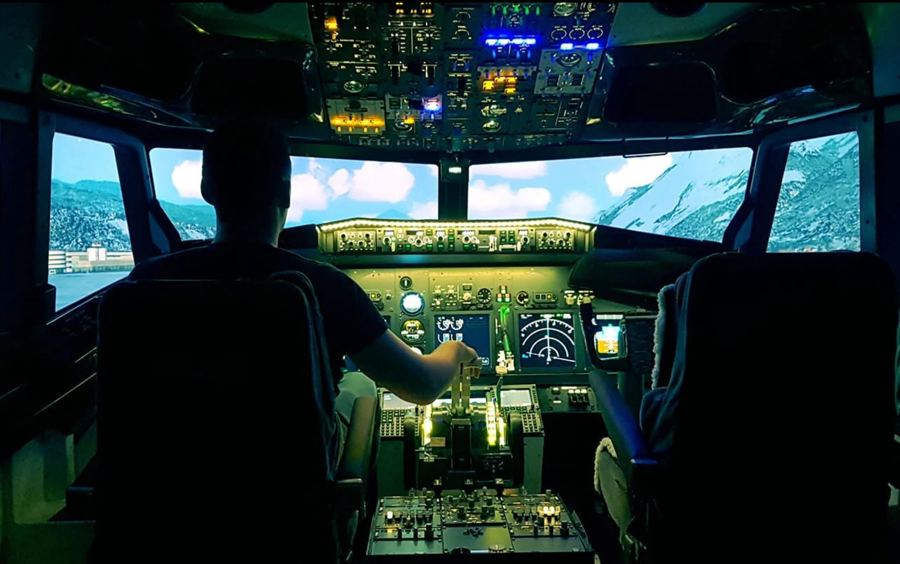 Powered 737 simulator with illuminated controls and scenery