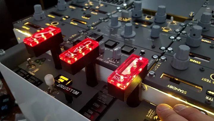 Illuminated simulated fire handles